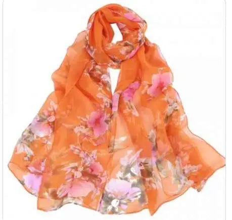 A flowing orange oil painting floral georgette sunscreen scarf with delicate pink and muted purple flowers in lightweight sheer fabric A