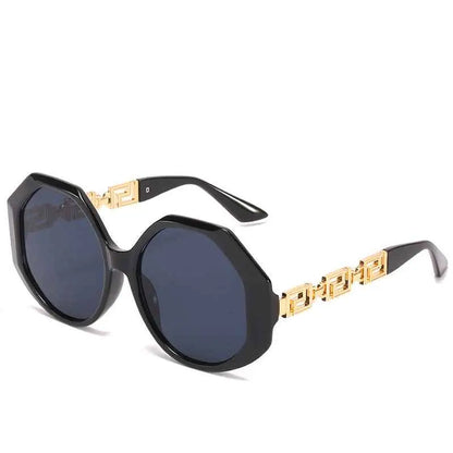 Oversized polygonal designer sunglasses with black octagonal frames gold-tone greek key temples and dark gray lenses In Stock