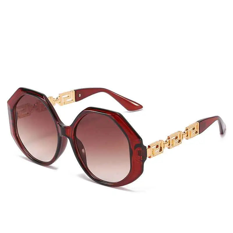 Oversized polygonal designer sunglasses in burgundy with gold-toned geometric arms and gradient brown lenses from trend den In Stock
