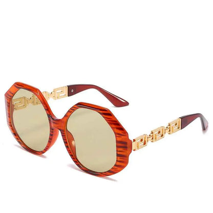 Oversized polygonal designer sunglasses with orange tortoiseshell acetate frame and gold-tone Greek key arms from trend den In Stock
