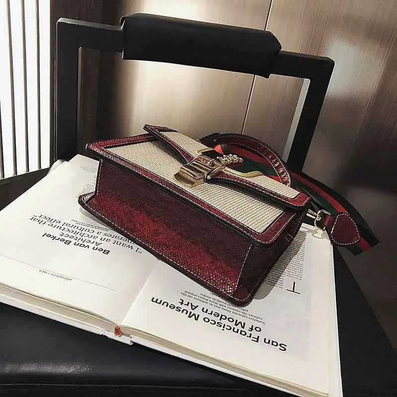 Plaid satchel with red and beige snakeskin snake trim and gold-tone clasp from gucci trend den collection