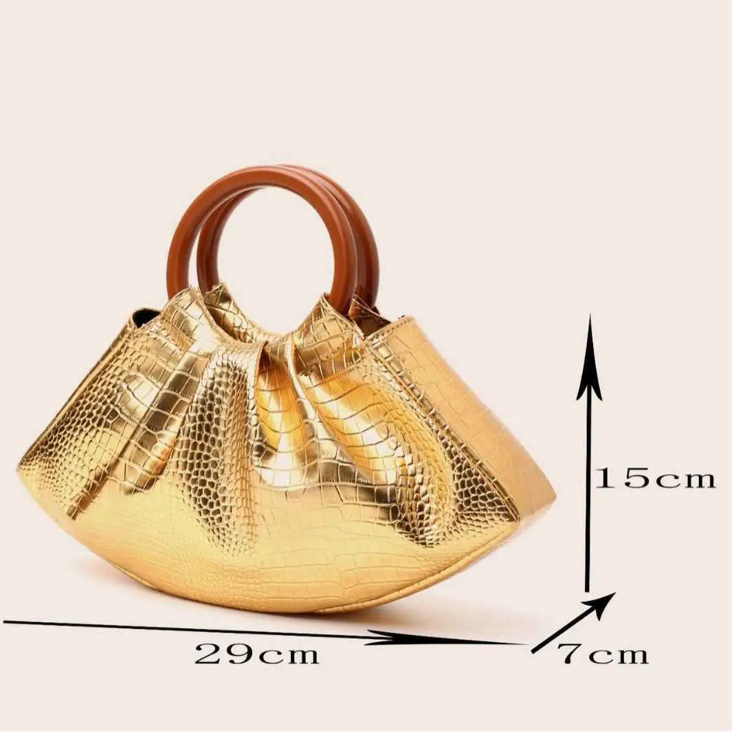 Golden crocodile-patterned pleated shell-shaped handbag with brown wooden handle from trend den
