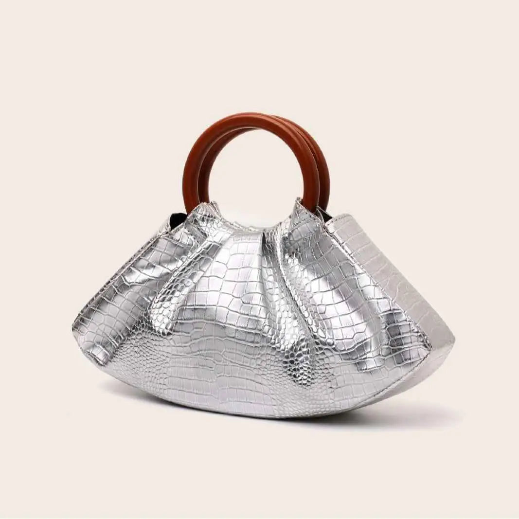 Silver crocodile-embossed pleated shell-shaped handbag with brown wooden handle from trend den collection