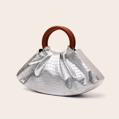Silver crocodile-embossed pleated shell-shaped handbag with brown wooden handle from trend den collection