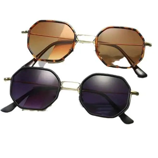 A pair of polygon geometric metal sunglasses with tortoiseshell and black frames and gradient brown and dark purple lenses from trend den