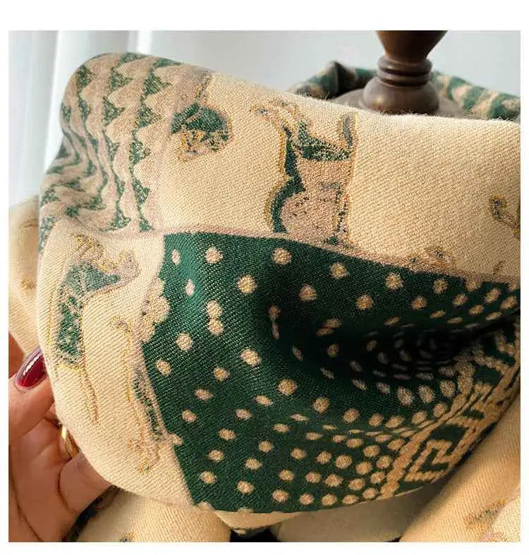 Retro carriage jacquard tassel scarf in cream and forest green with embroidered deer motifs and dotted designs