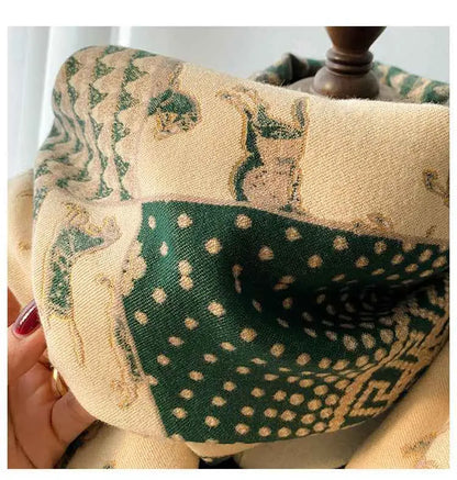 Retro carriage jacquard tassel scarf in cream and forest green with embroidered deer motifs and dotted designs
