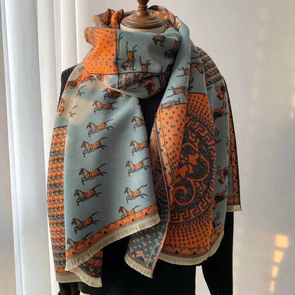 A retro carriage jacquard tassel scarf with an oversized vibrant orange and gray running dogs pattern and geometric design Sky Blue