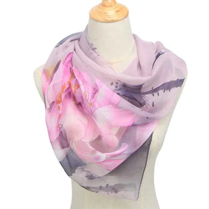 A delicate lavender and pink retro ethnic floral georgette sunscreen scarf draped elegantly on a mannequin Light Purple