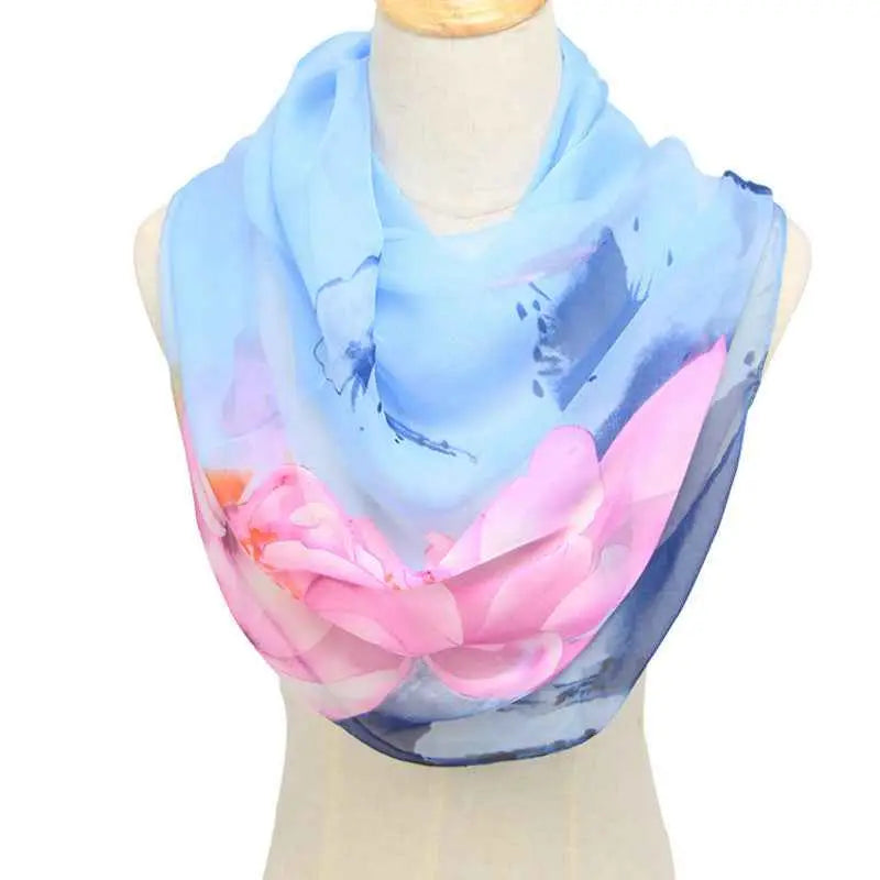 A delicate light blue georgette infinity scarf with vibrant pink retro ethnic floral design and soft gradient accents Sky Blue