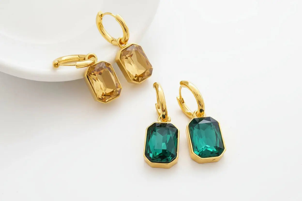 Gold hoop earrings with rectangular amber and teal faceted gemstones in retro gemstone titanium gold design