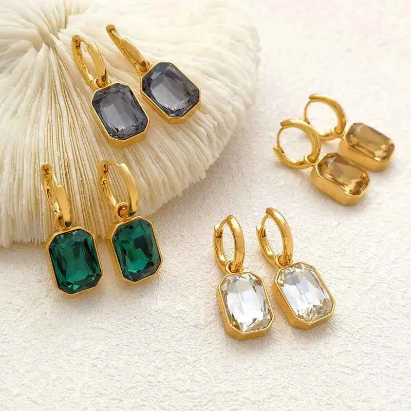 Gold hoop earrings with rectangular faceted gray green and clear gemstones in retro gemstone titanium style