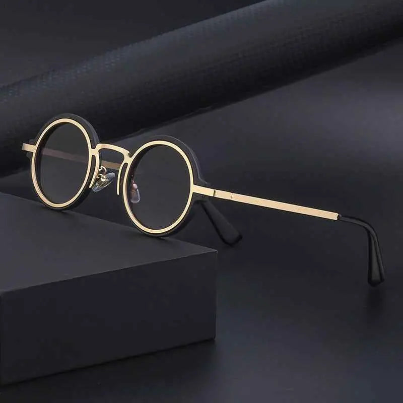 Retro round-rim sunglasses with gold rims dark lenses and black temple tips for uv protection from trend den