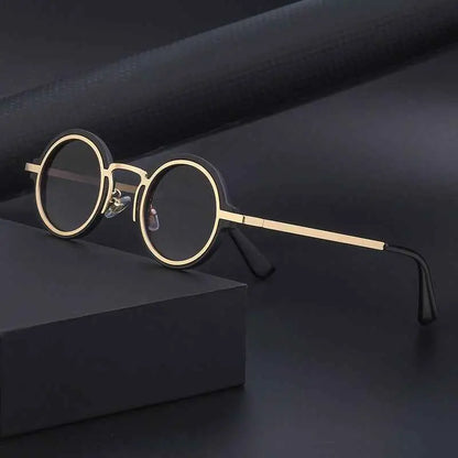 Retro round-rim sunglasses with gold rims dark lenses and black temple tips for uv protection from trend den