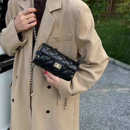 Black quilted leather rhombus-pattern structured crossbody bag with gold-tone chain strap from trend den Black