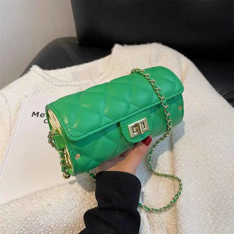 Vibrant green quilted leather rhombus-pattern structured crossbody bag with gold-tone chain strap and clasp from trend den