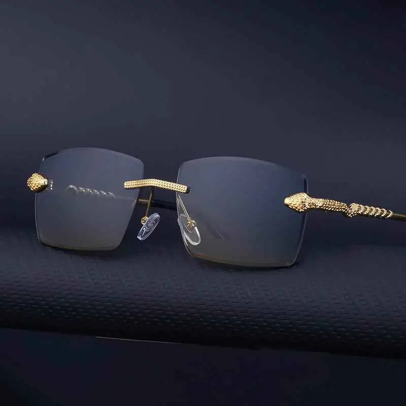 Rimless rectangular gradient sunglasses with gold-toned snake-head frame and dark gray lenses from trend den