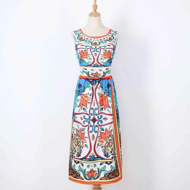 A vibrant sleeveless retro print cake maxi dress with bold floral and leopard print in orange blue green and white Printing