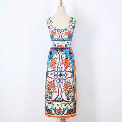Sleeveless retro print cake dress by Dolce & Gabbana with bold floral and leopard print in orange blue red and green