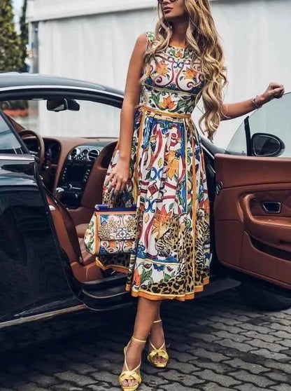 Sleeveless retro print cake dress by Dolce & Gabbana featuring vibrant floral and leopard print with gold trim