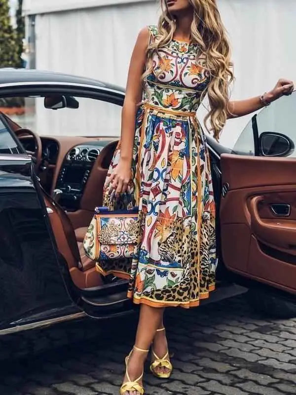 Vibrant multicolored sleeveless retro print cake dress with intricate floral and animal motifs in midi length