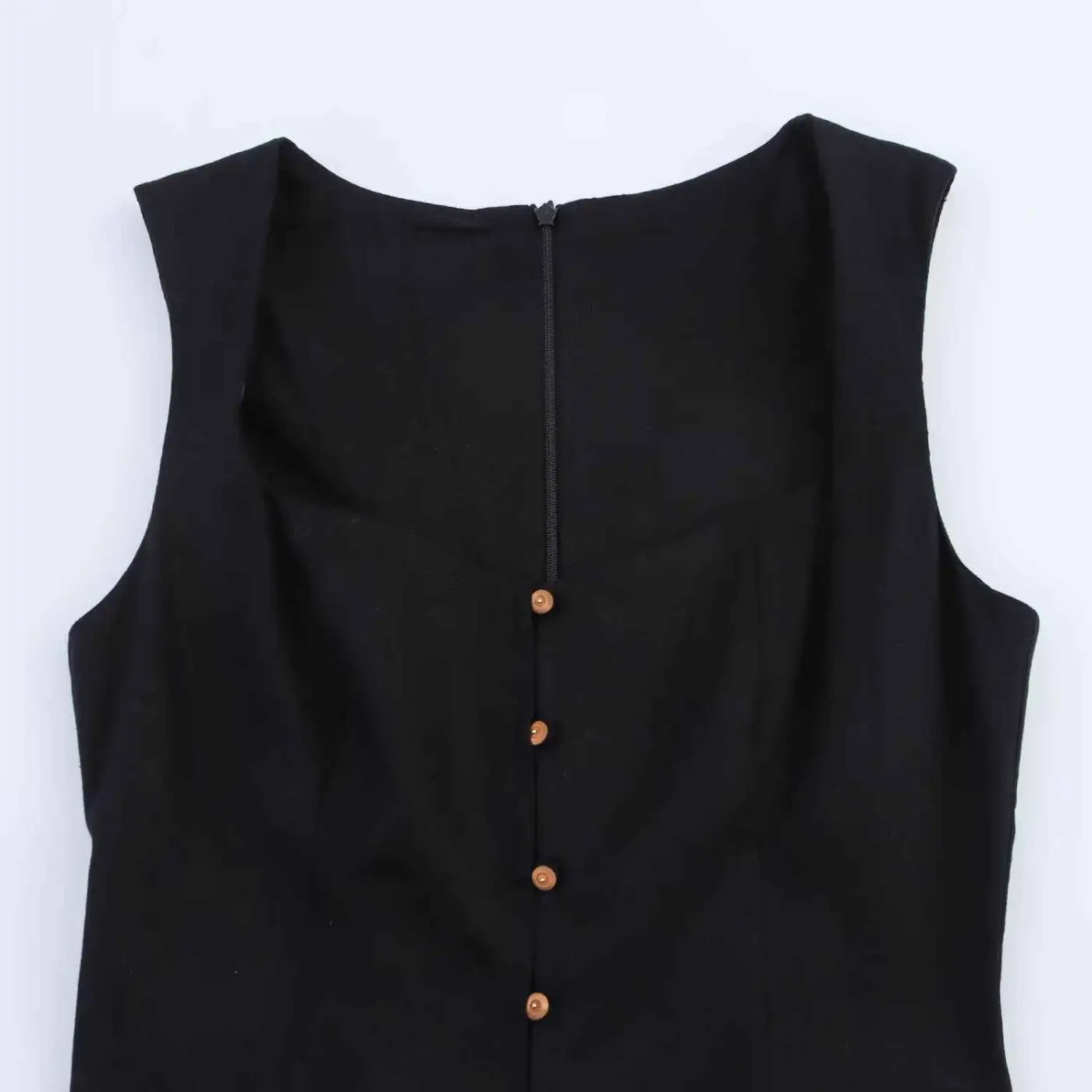 Back view of black sleeveless slim-fit linen midi dress with central zipper and wooden buttons down the back