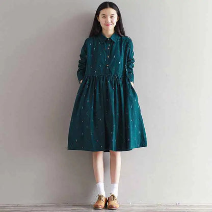 Dark green long sleeve printed corduroy dress with subtle embroidery and button-down collar south african style