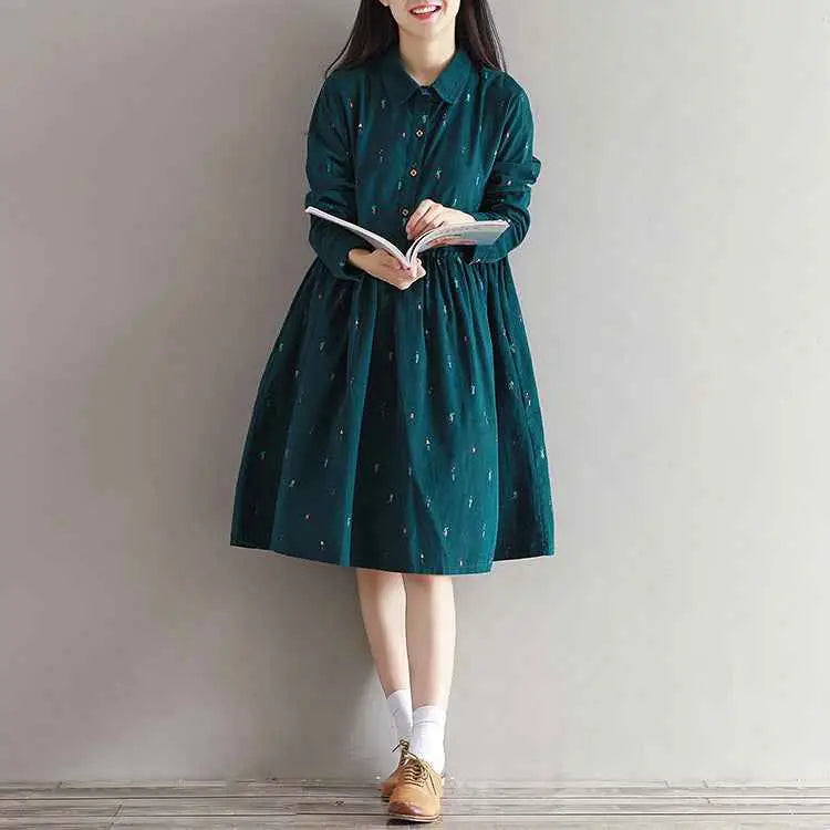 Long sleeve printed corduroy dress in dark green with subtle light embroidered details south african style