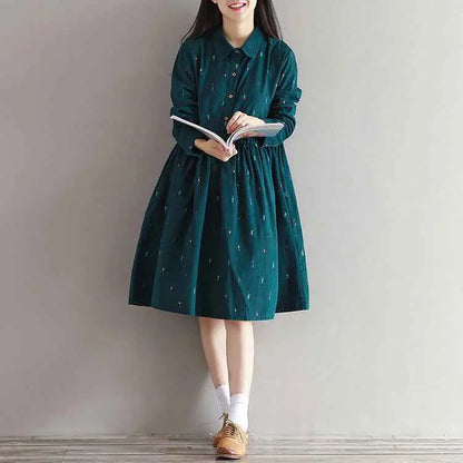 Long sleeve printed corduroy dress in dark green with subtle light embroidered details south african style