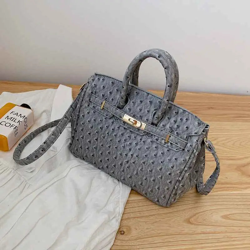 Gray structured ostrich-pattern handbag with durable polyester, gold-tone hardware, and top handle from trend den gray