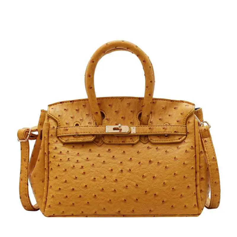 Structured ostrich-pattern handbag in tan with embossed texture, gold-tone clasp, matching handles, and durable polyester
