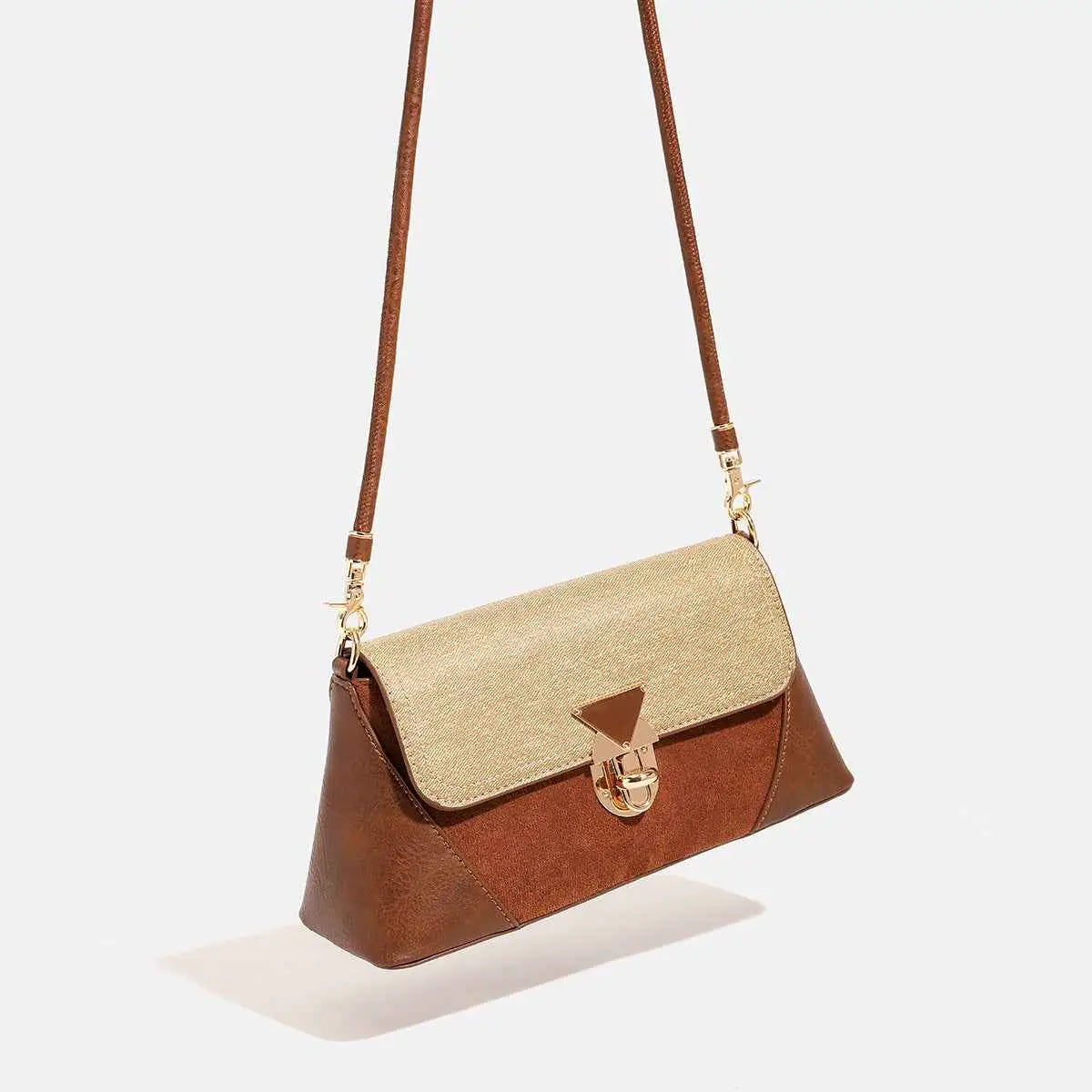 Brown and beige two-tone baguette underarm bag with a triangular gold-toned clasp from trend den