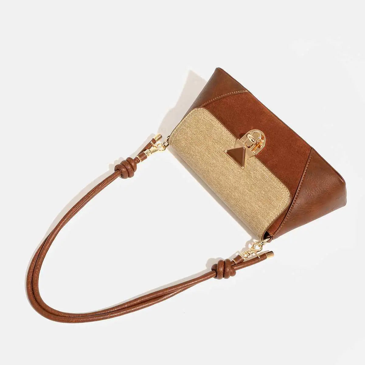 Brown and beige two-tone leather baguette underarm bag with triangular gold-toned clasp from trend den