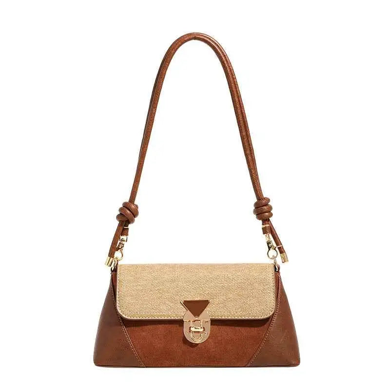 Brown and beige two-tone baguette underarm bag with suede body textured flap gold clasp and braided leather strap