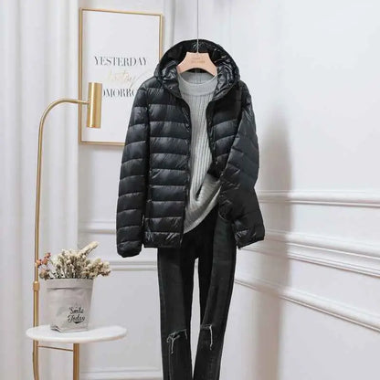 Black quilted ultra-lightweight women’s hooded down jacket made with white duck material from trend den south african brand Black