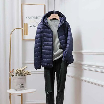 Navy blue quilted ultra-lightweight women’s hooded down jacket filled with white duck feathers by trend den Navy Blue