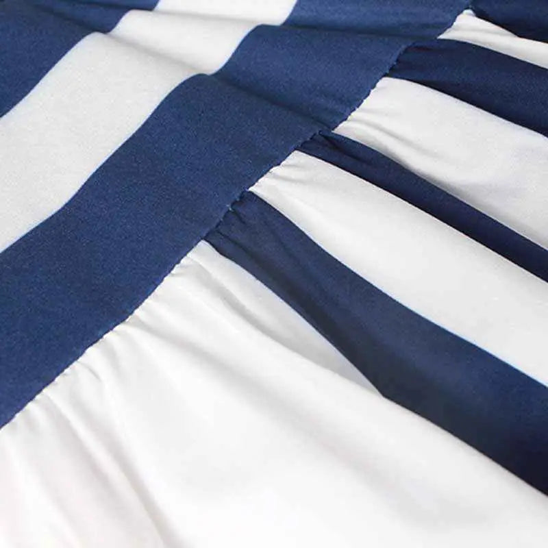 Navy blue and white striped fabric with soft texture of a vintage sleeveless printed midi dress