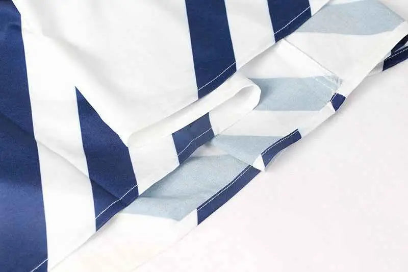 Vintage sleeveless printed midi dress in navy blue and white striped fabric with subtle light blue geometric pattern