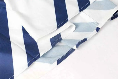 Vintage sleeveless printed midi dress in navy blue and white striped fabric with subtle light blue geometric pattern