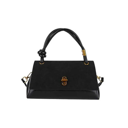 Black leather vintage structured buckle tote and crossbody bag with gold-tone hardware and knotted top handle from trend den Black