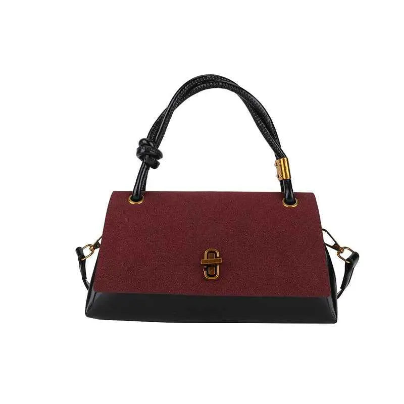 Vintage structured buckle tote and crossbody bag with burgundy textured upper black leather base and twisted black handles Wine Red