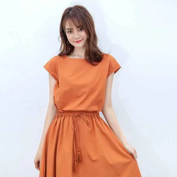 Soft orange sleeveless swing dress with gathered waist and drawstring tie made of cotton linen fabric south african style Orange