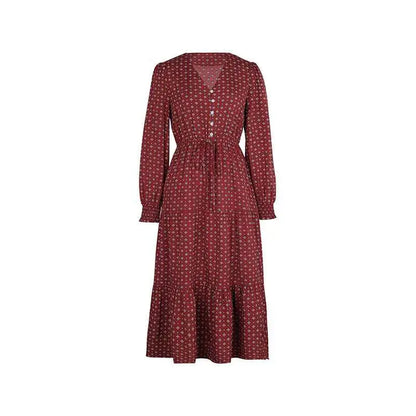 A maroon long sleeve printed autumn dress with a subtle geometric print and button front design midi length