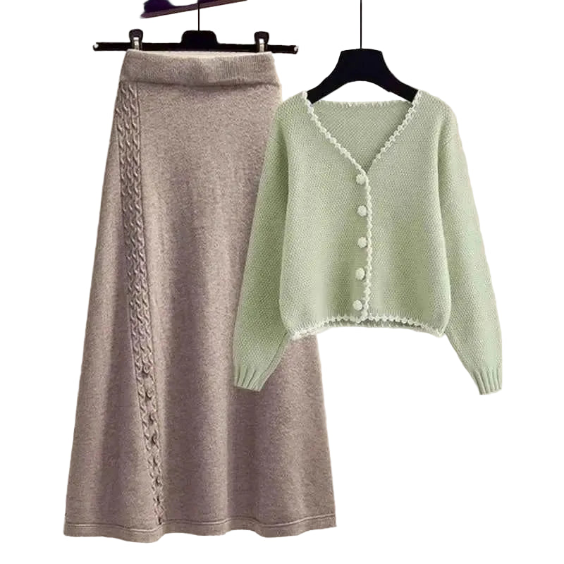 Soft mint green knit winter sweater with white lace trim and pearl buttons paired with gray cable knit skirt two-piece set