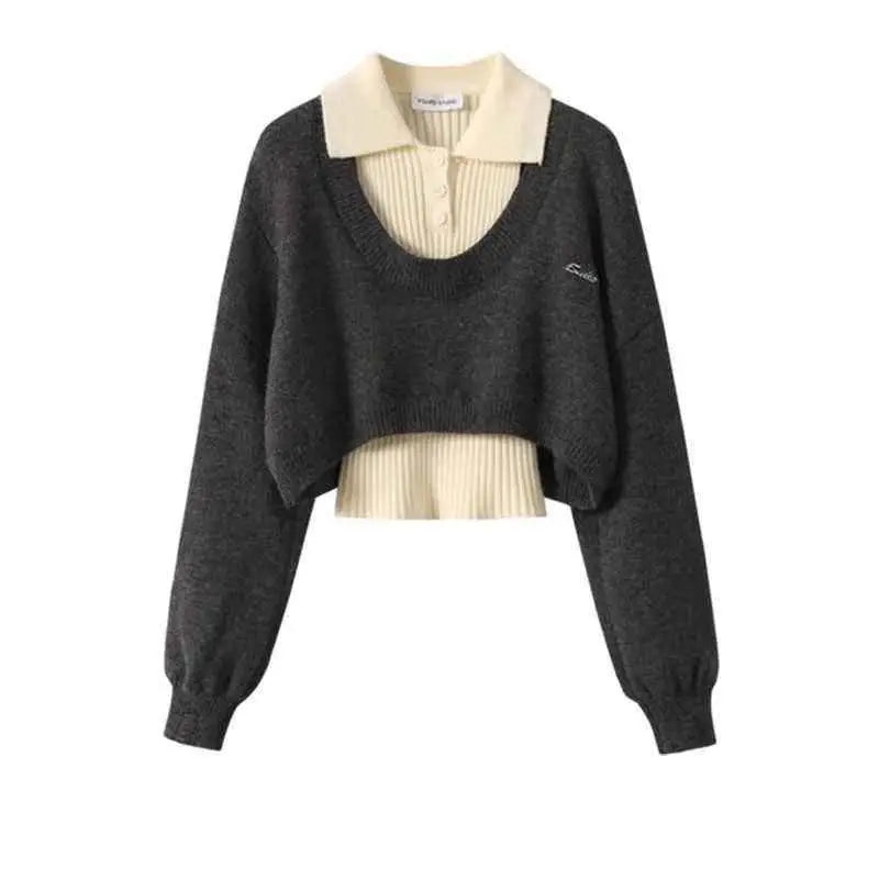 Dark gray cropped knit winter sweater vest with cream ribbed polo collar and ruffled hem featuring chest embroidery