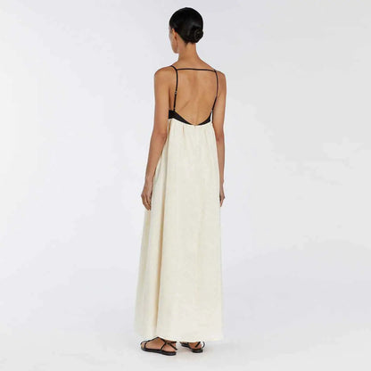 Off-white cotton linen sleeveless maxi dress with thin black straps and backless design for casual wear