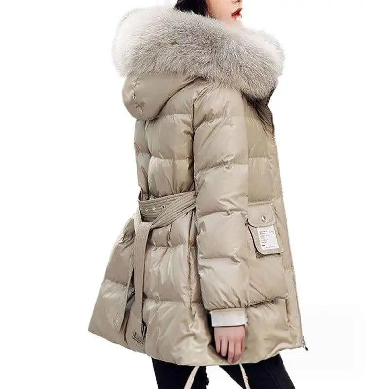 Women’s slim-fit padded down jacket in beige with plush gray fur-lined hood and silk cotton filler with matching belt