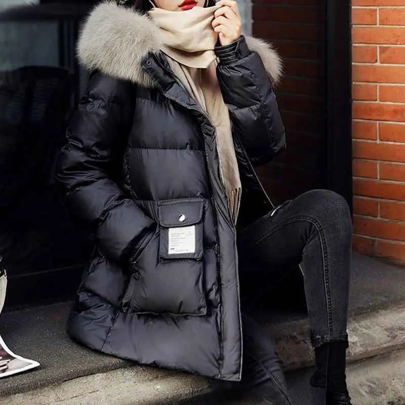 Women’s slim-fit padded down jacket in black with plush fur-lined hood silk cotton filler and silver button pocket