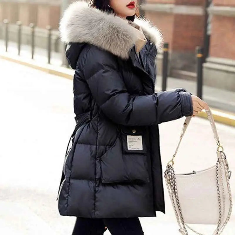 Women’s slim-fit padded down jacket in black with silk cotton filler and a plush silver-gray fur-lined hood